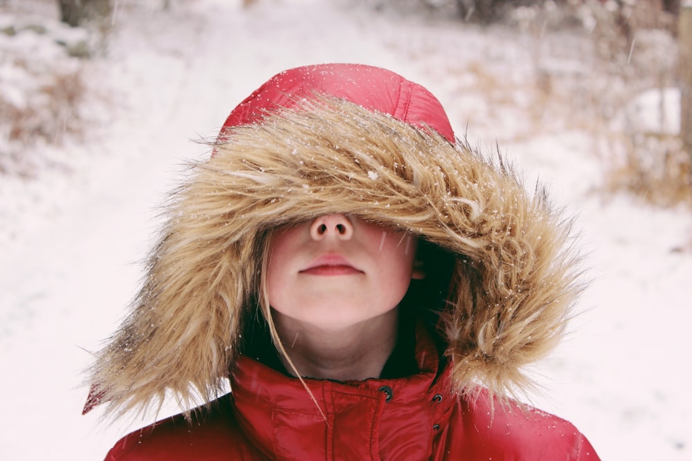 woman wearing beige and red hoodie