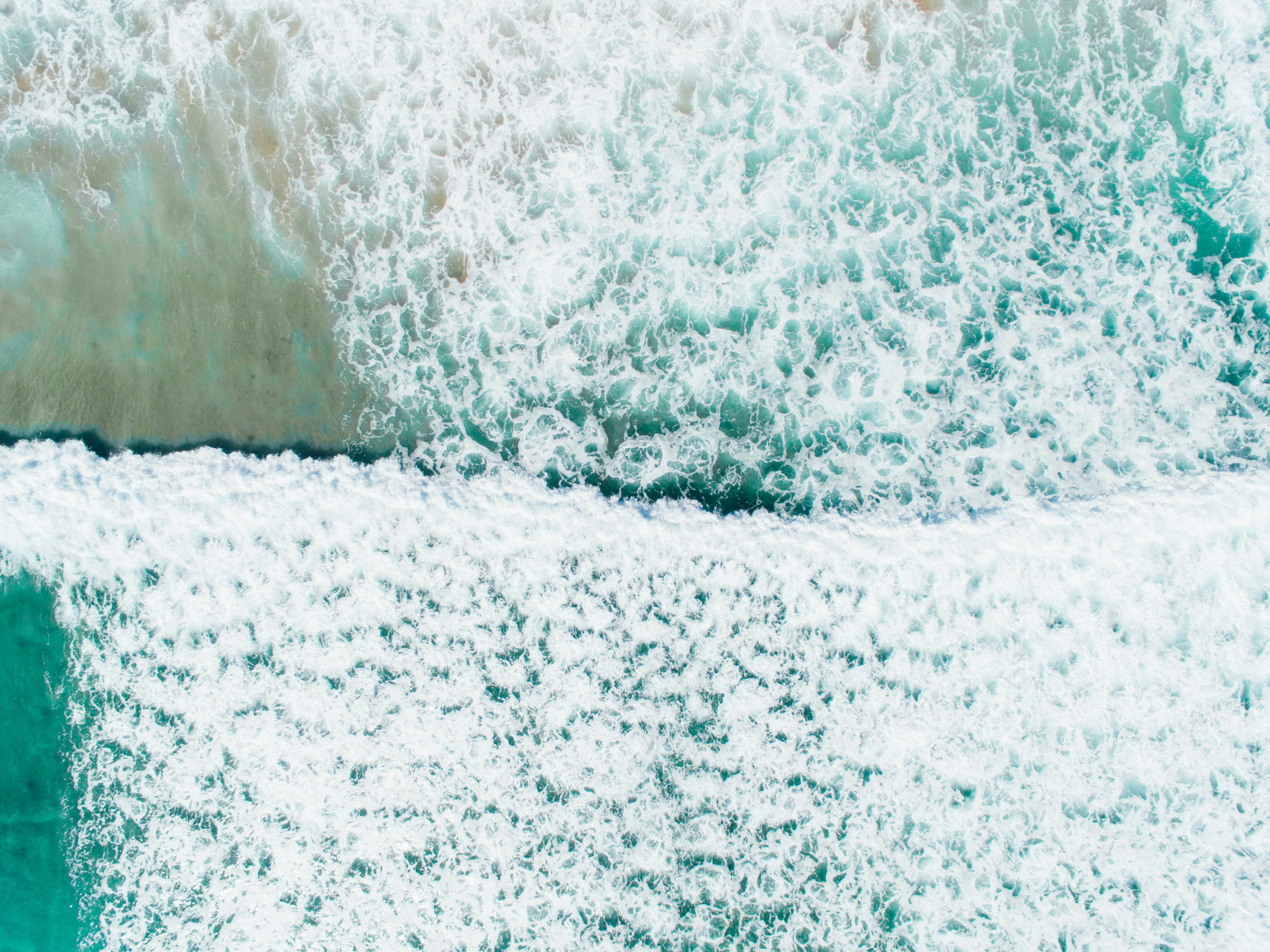 Bird's eye view of sea waves photo – Free Sea Image on Unsplash