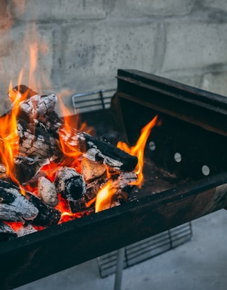 flaming charcoal on black grill