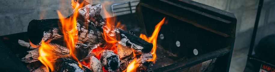 flaming charcoal on black grill