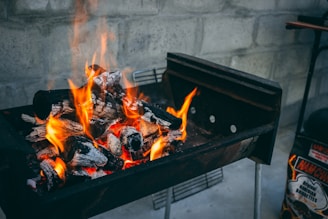 flaming charcoal on black grill