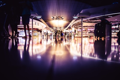 people standing on lighted room