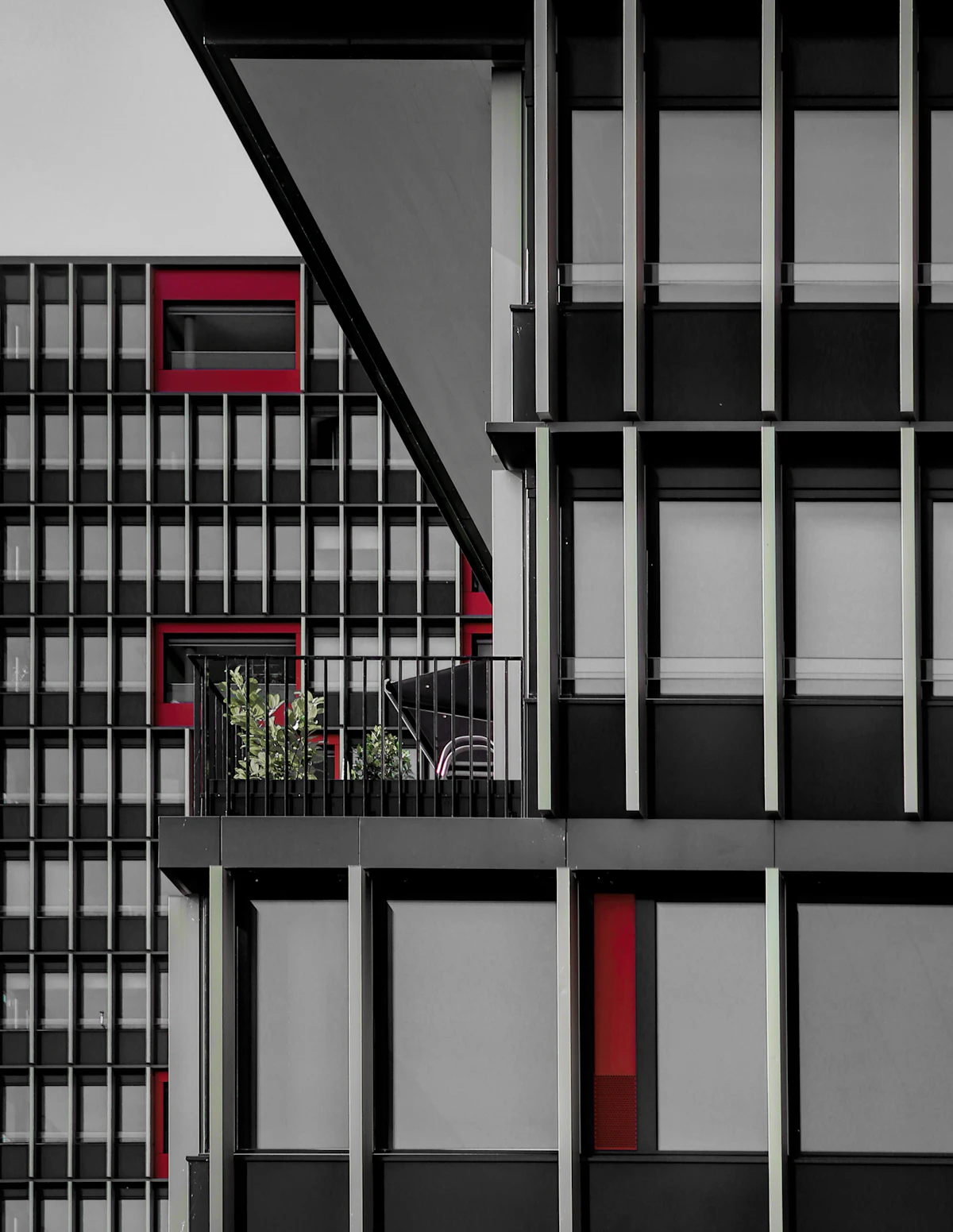 Slim aluminium window and balcony frames on a contemporary apartment building