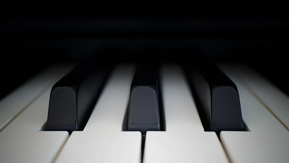 Close-up of piano keys in warm light