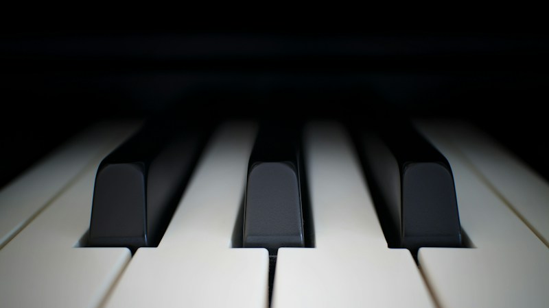 Worn black and white piano keys on an older upright piano of the kind often found in Clark County school music rooms
