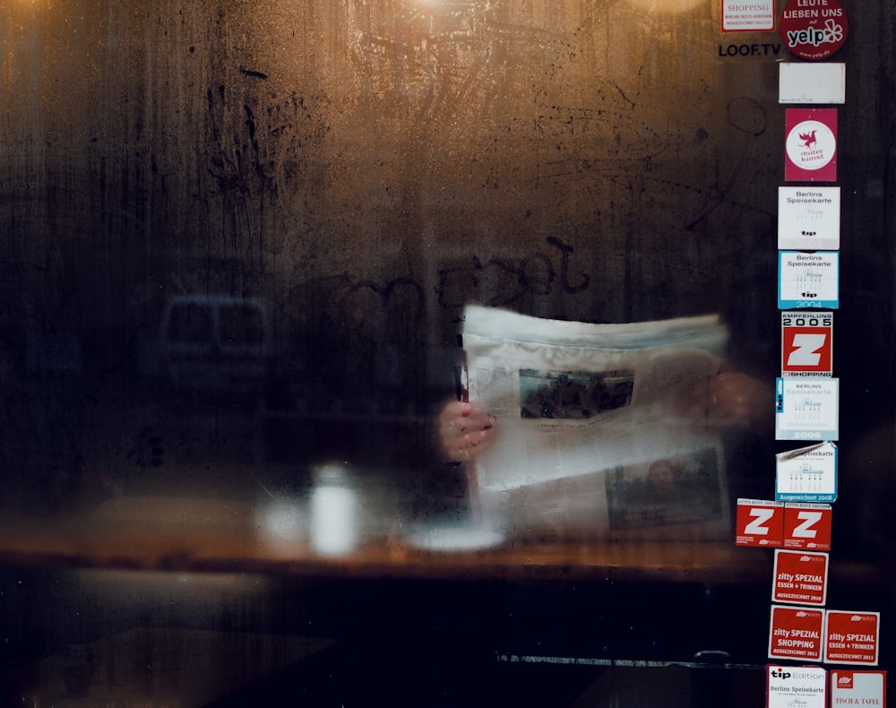 person holding newspaper