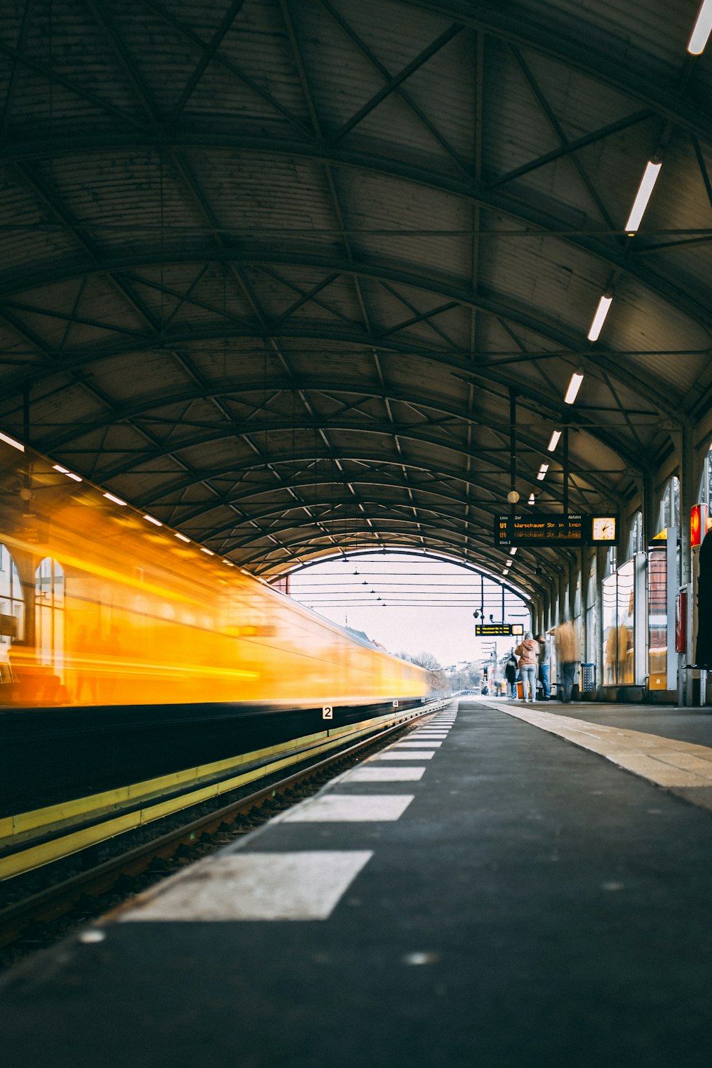 train passing by on train station at daytime