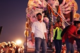 Devotees gathered around the mandap during evening prayers.
