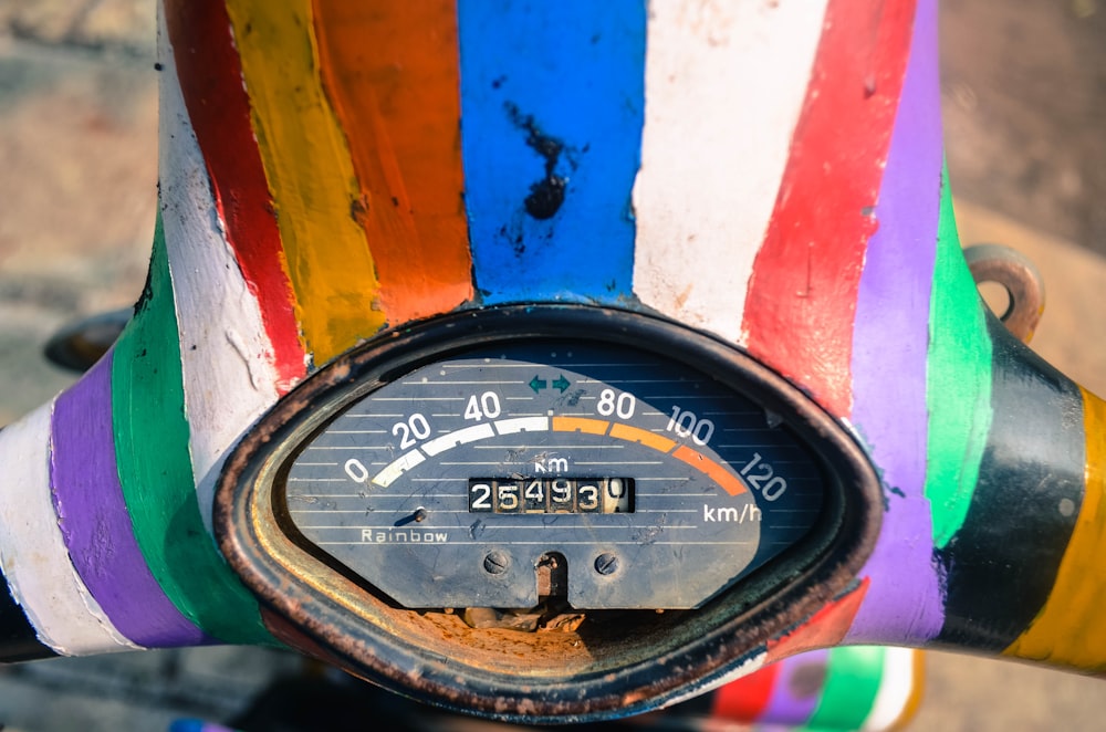 multicolored motorcycle speedometer