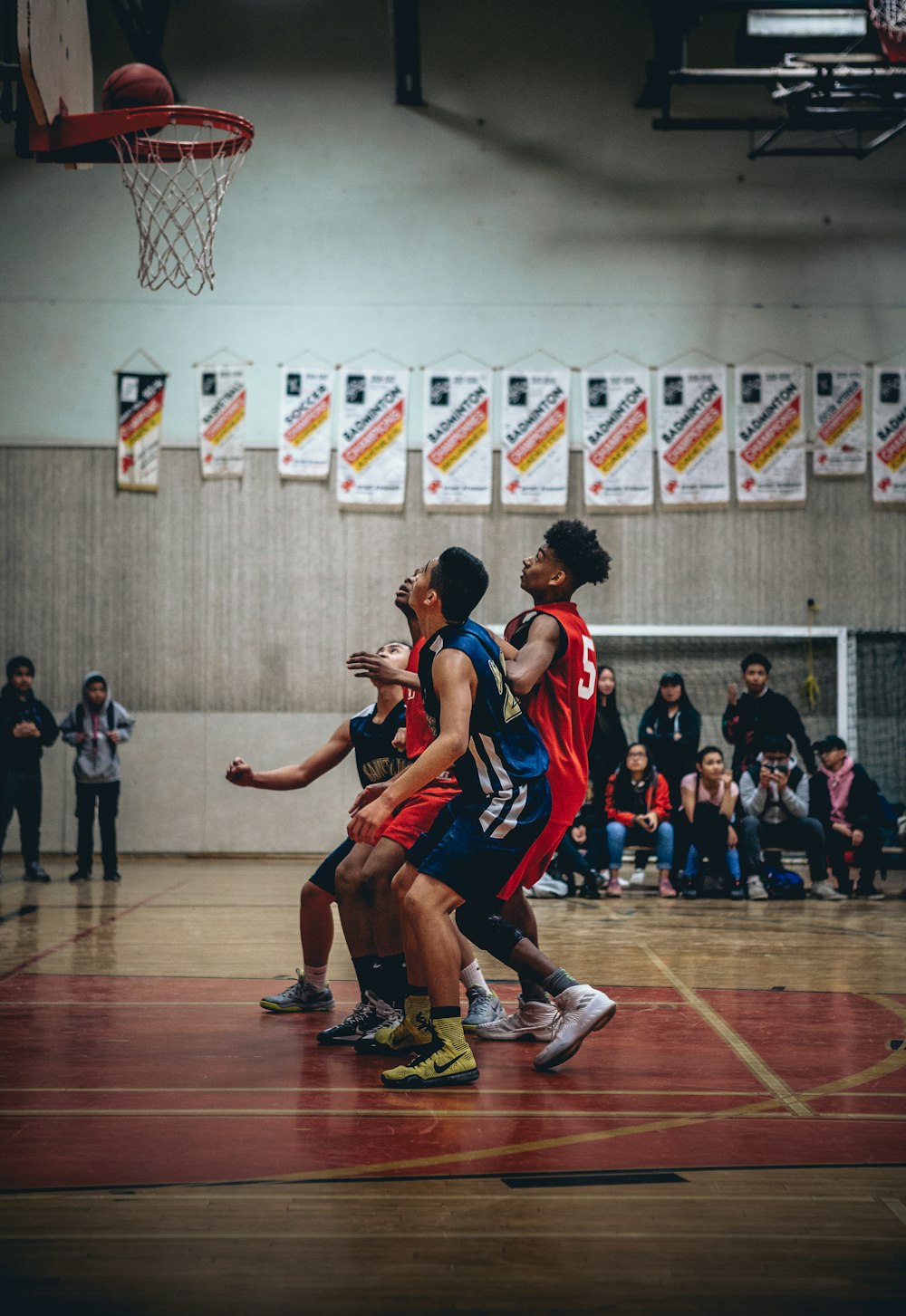 group of people playing basketball