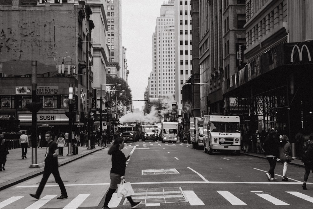 woman in black top walking on roadway