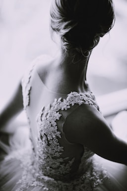 grayscale photography of a woman in lace sleeveless dress