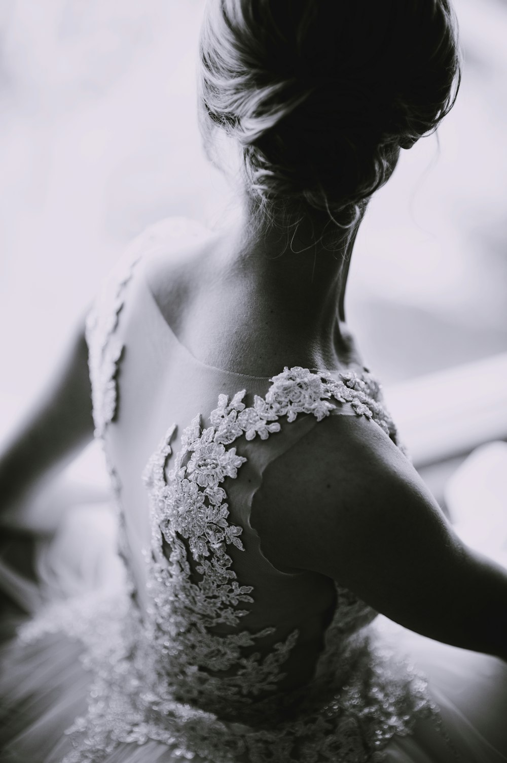 grayscale photography of a woman in lace sleeveless dress