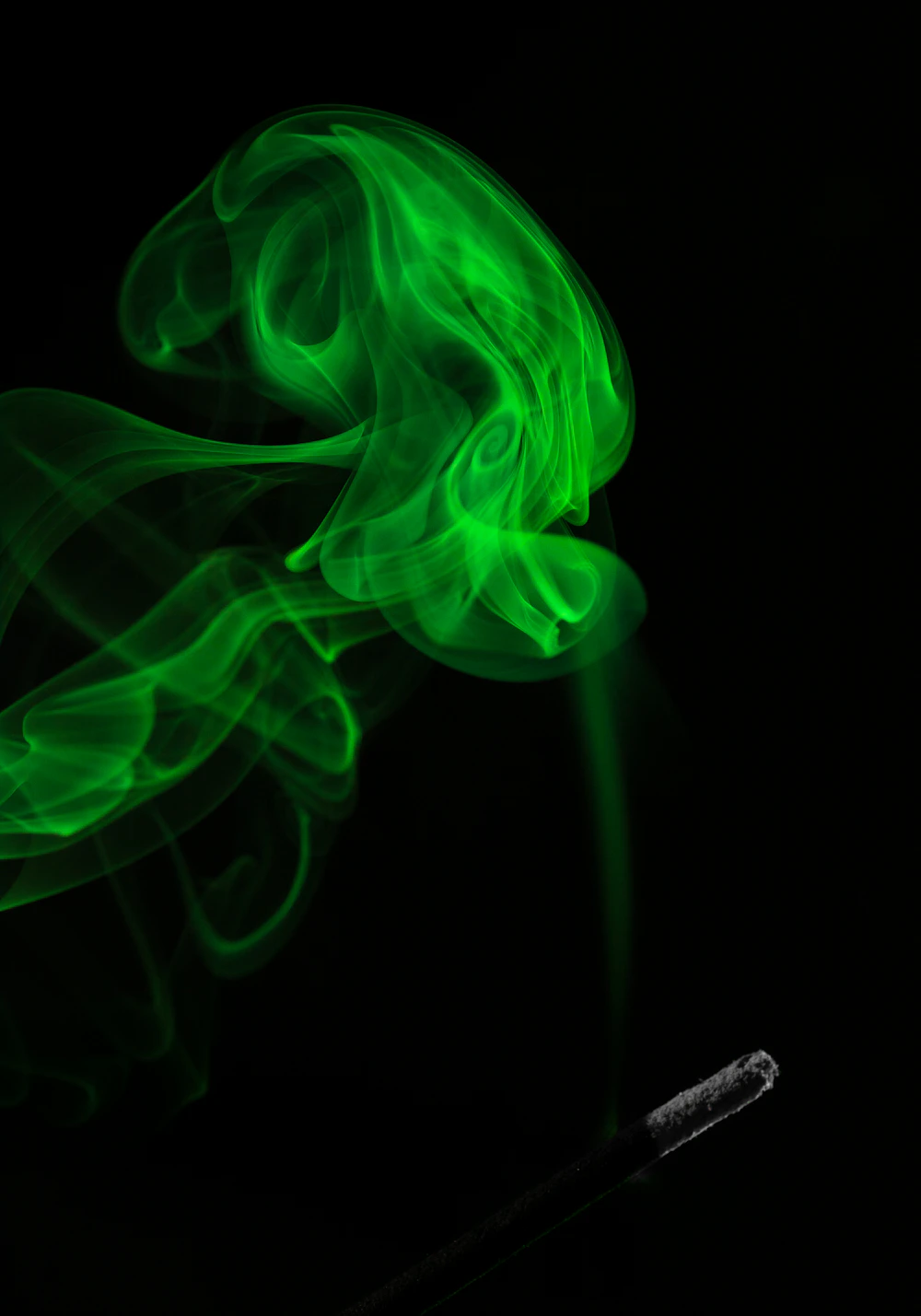 Burning incense with a delicate trail of smoke