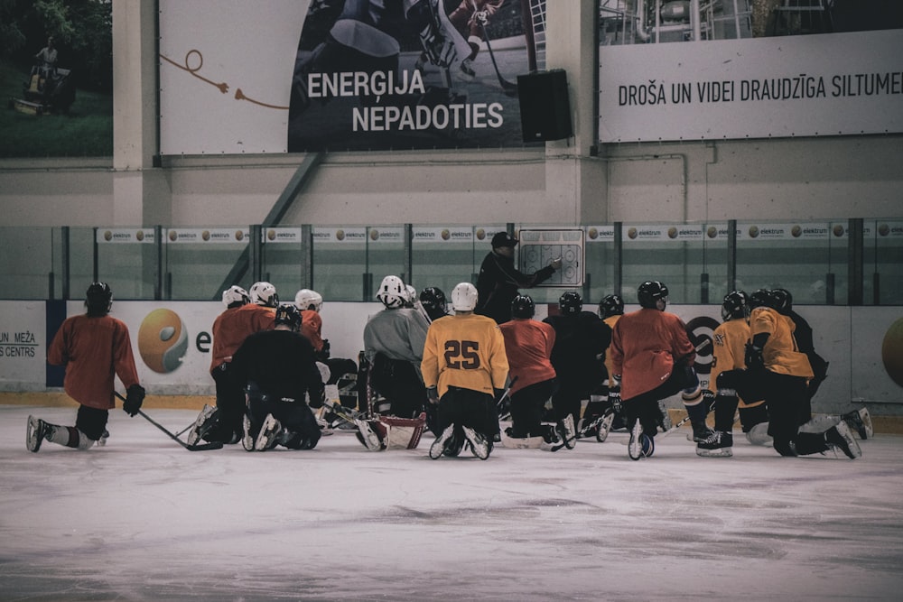 hockey coach in front of hockey player