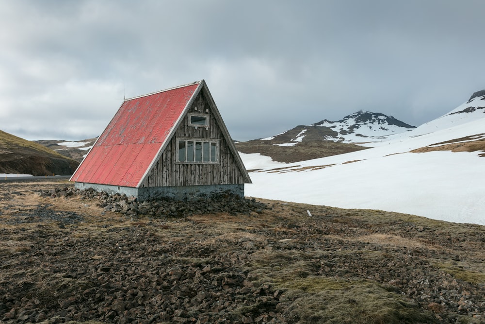 brown and red house near mountains during daytime