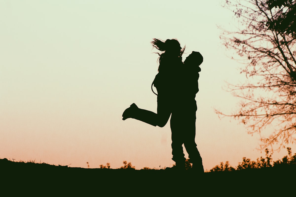 A loving married couple embracing outdoors