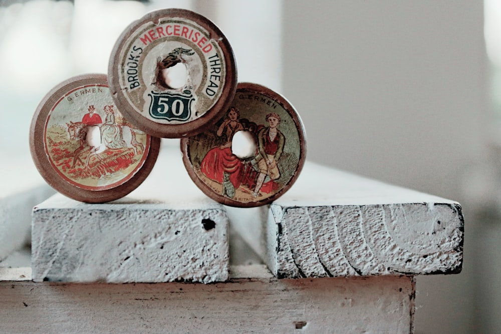 photo of three assorted-color-and-design commemorative coins