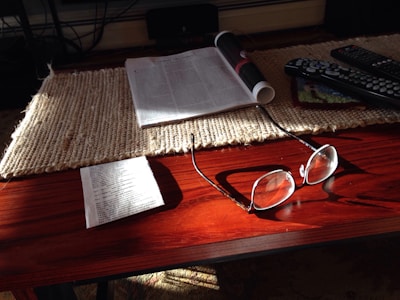 The Dryhome drying mat laid out on a wooden table with sunlight highlighting its texture.