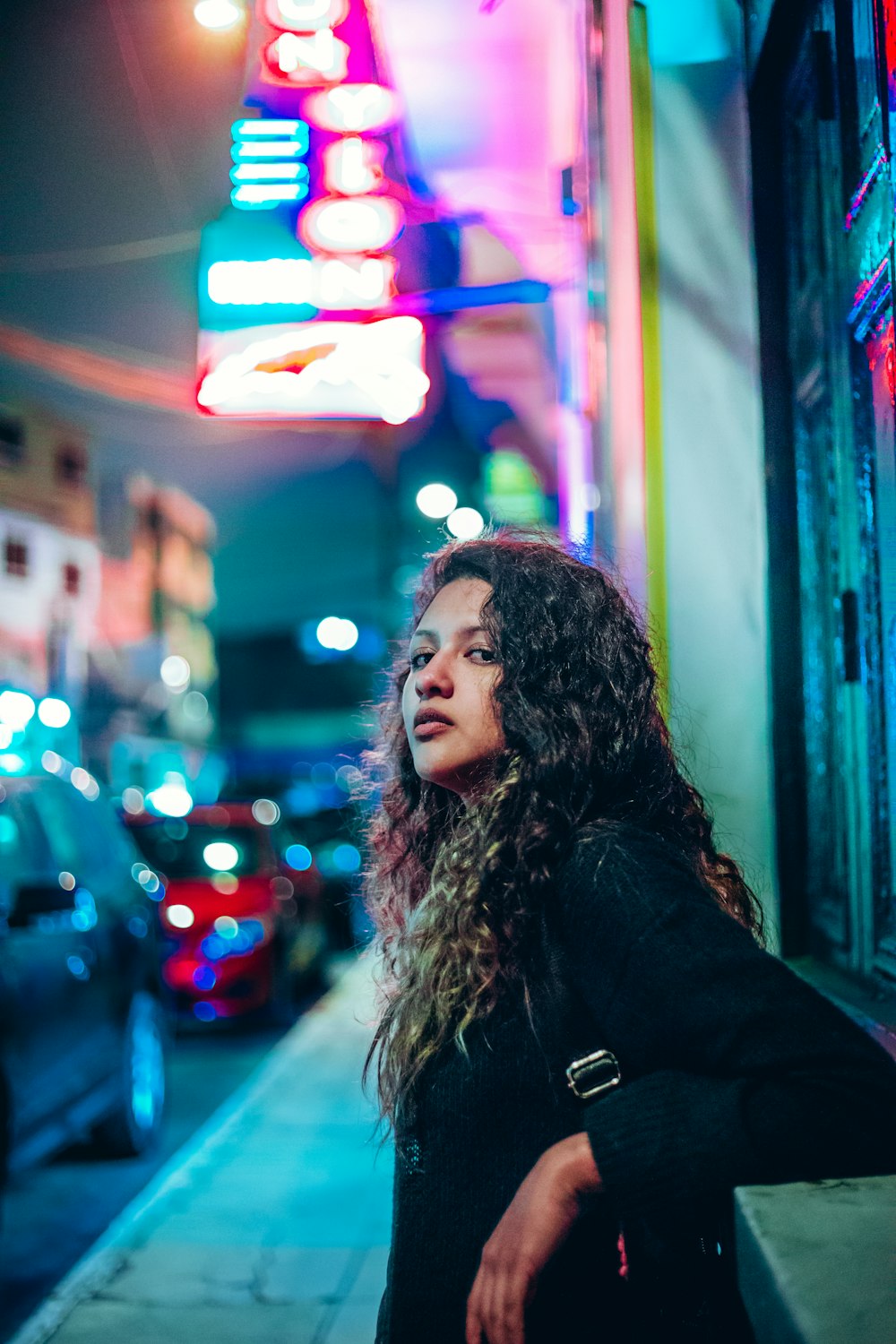 woman beside building structure