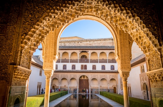 brown and white building under clear blue sky during daytime in Alhambra Palace Spain