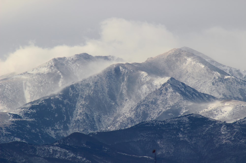 mountains covered with smoke during daytime