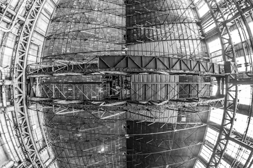 A detailed 3D laser scan of an industrial hall showing complex geometry.