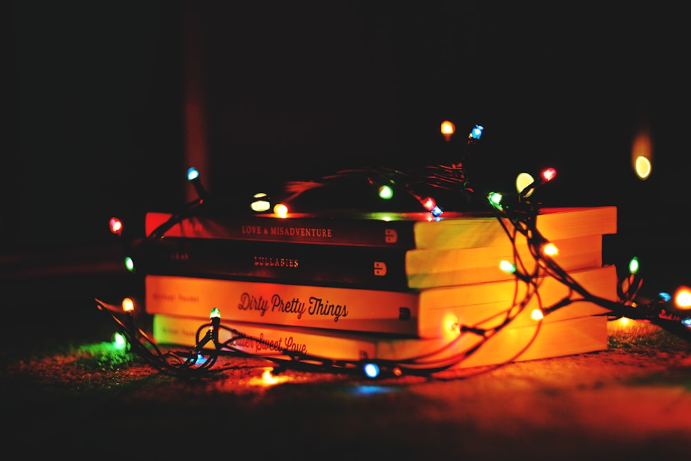 pile of books with LED strip lights