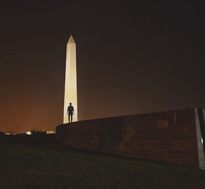 man standing on front of Obelisk in Egypt