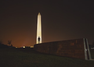 man standing on front of Obelisk in Egypt