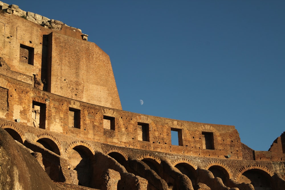 silhouette photo of The Colosseum wall