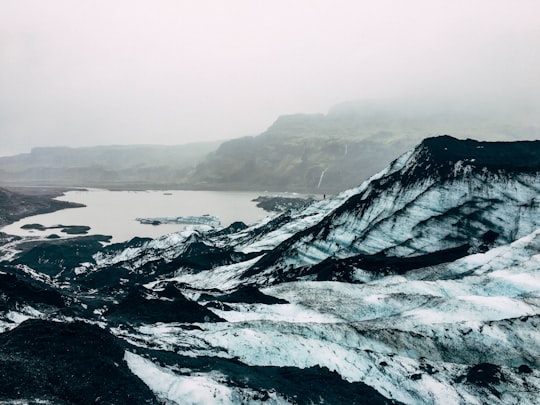 lake near snow-covered mountain in Sólheimajökull Iceland