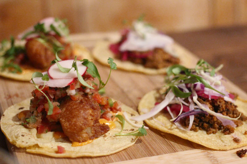 Tacos plated on the wooden board
