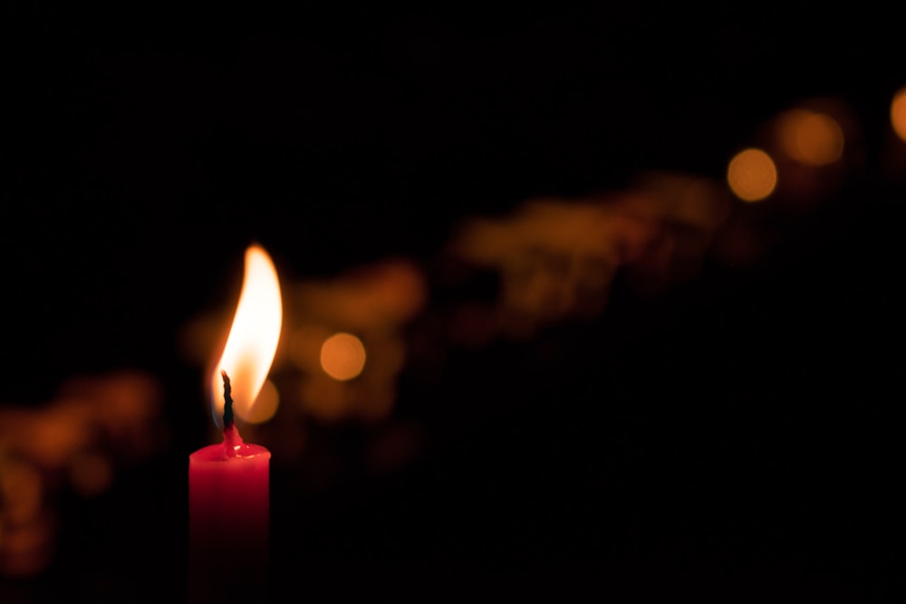 selective focus photography of red candle