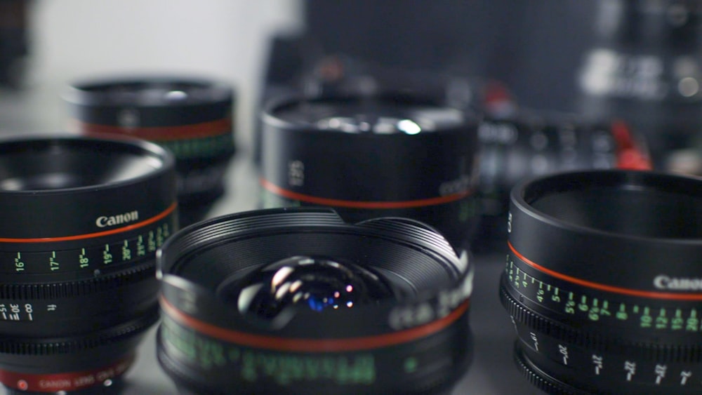 selective focus photography of Canon lenses