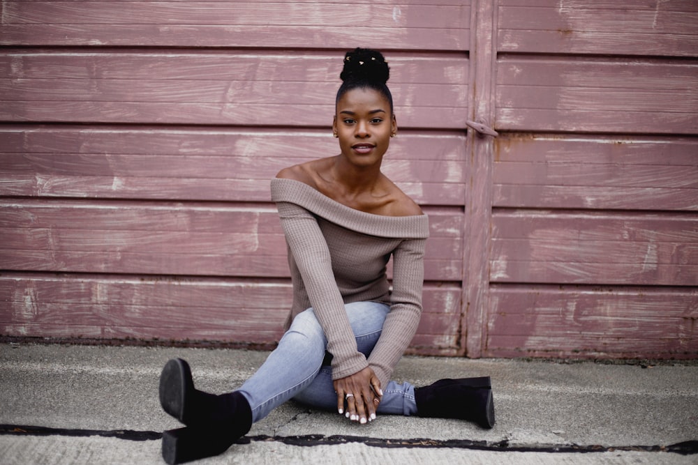 woman sitting on concrete floor