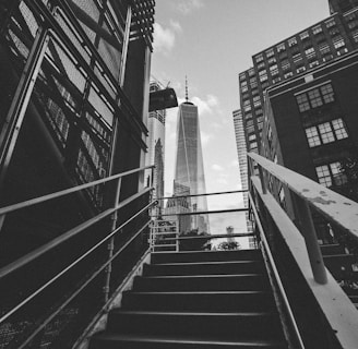 grayscale photography of stairway leading to building