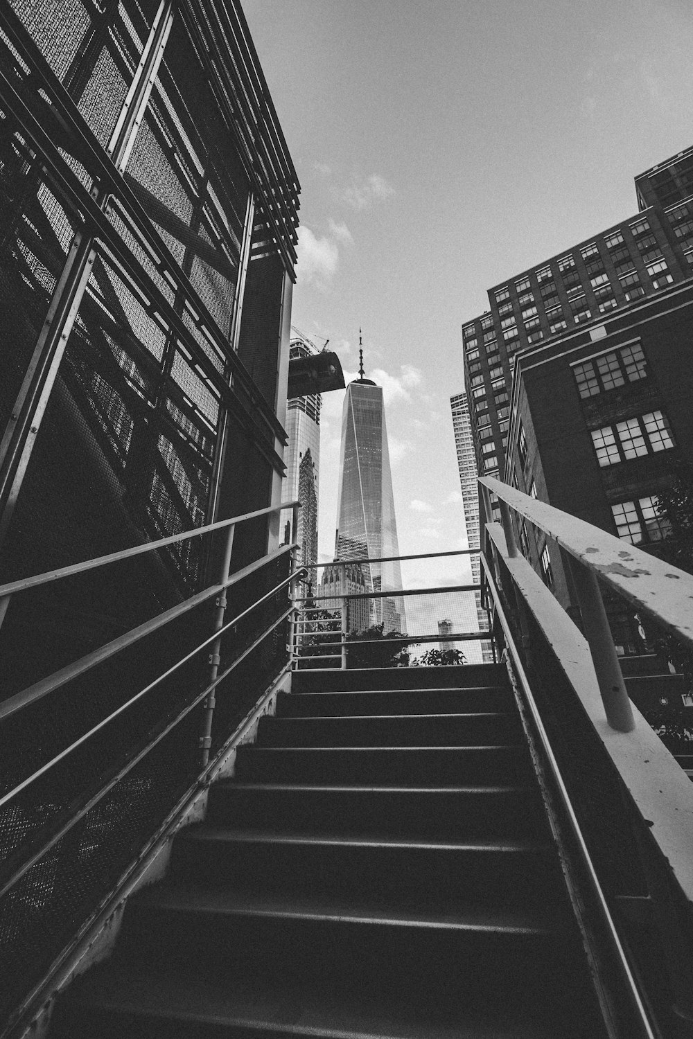 grayscale photography of stairway leading to building