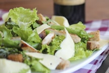 meat with lettuce on white ceramic plate