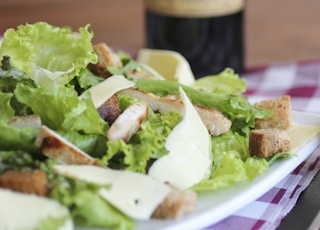 meat with lettuce on white ceramic plate