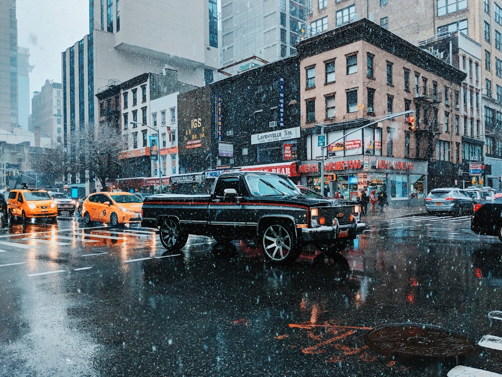 black single-cab pickup truck in street at daytime