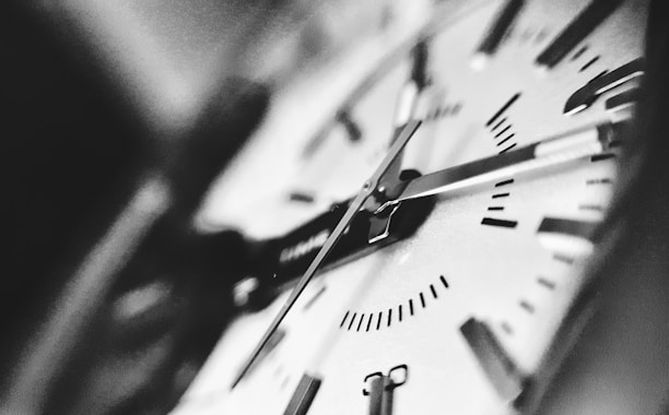 Close-up of a clock and calendar symbolizing smart time management.
