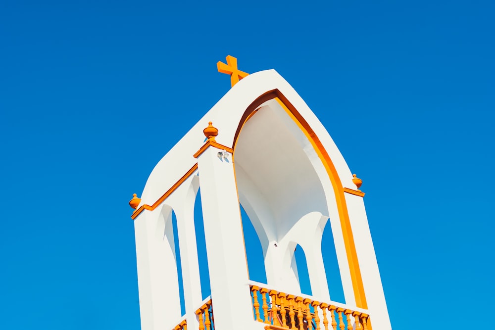 white and yellow building under blue sky