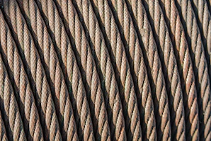 Industrial wires laid out in parallel lines, highlighting their durable insulation and robust build.