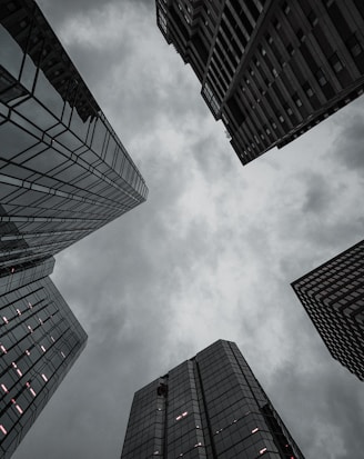 worm's eye-view of high-rise building under the cloudy sky