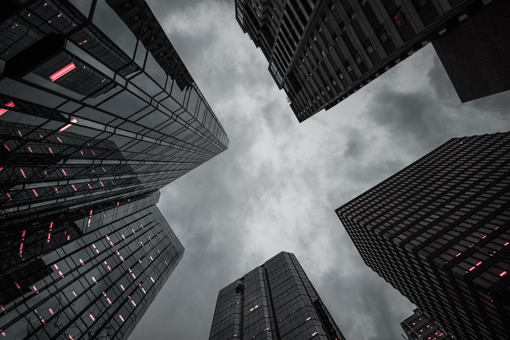 worm's eye-view of high-rise building under the cloudy sky