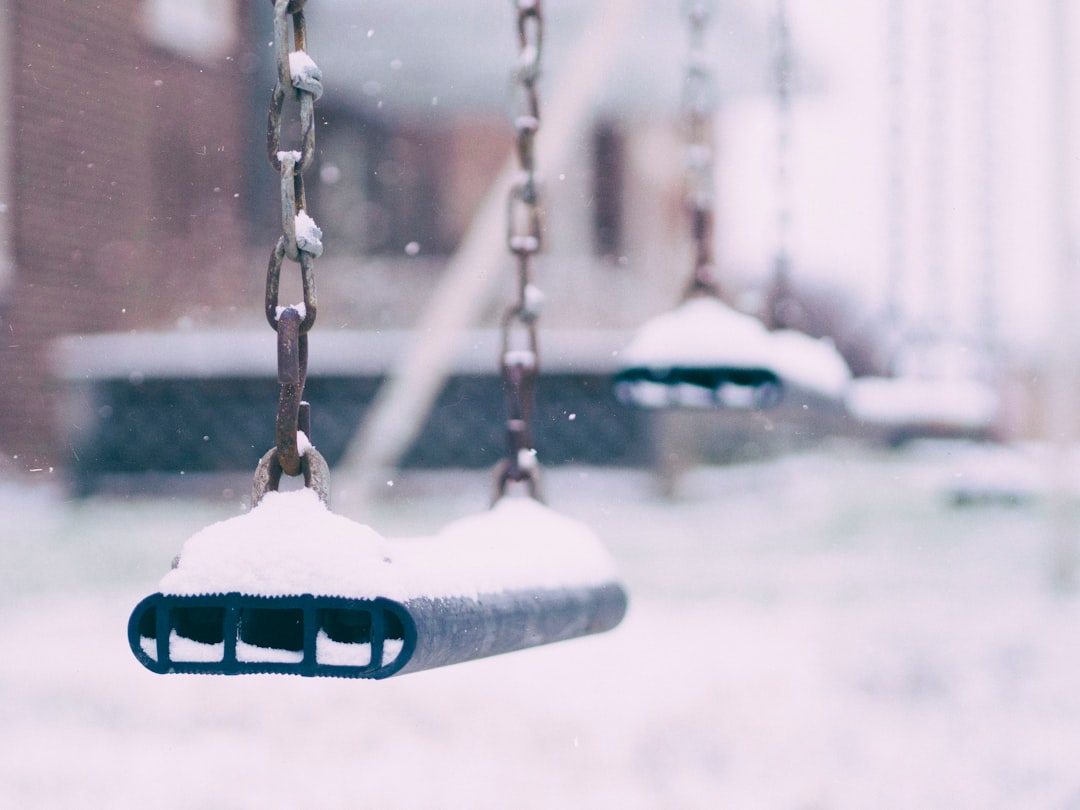swing coated with snow