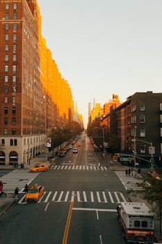 concrete road beside building during golden hour