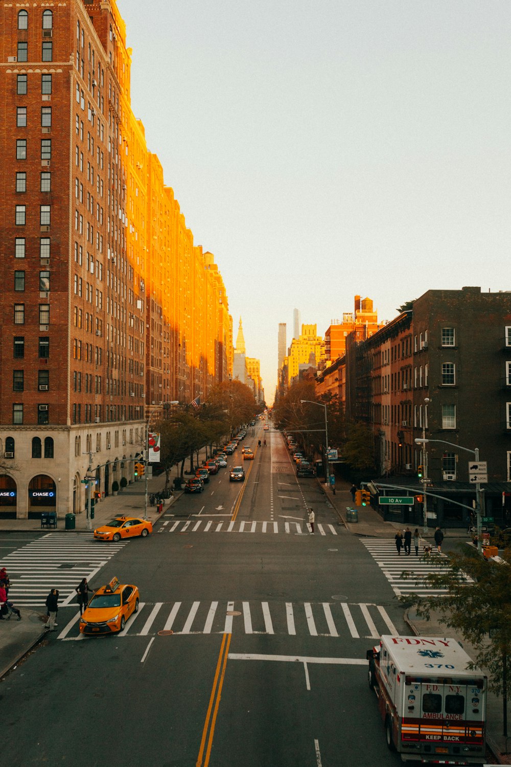 concrete road beside building during golden hour