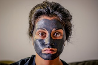 woman with gray facial mask